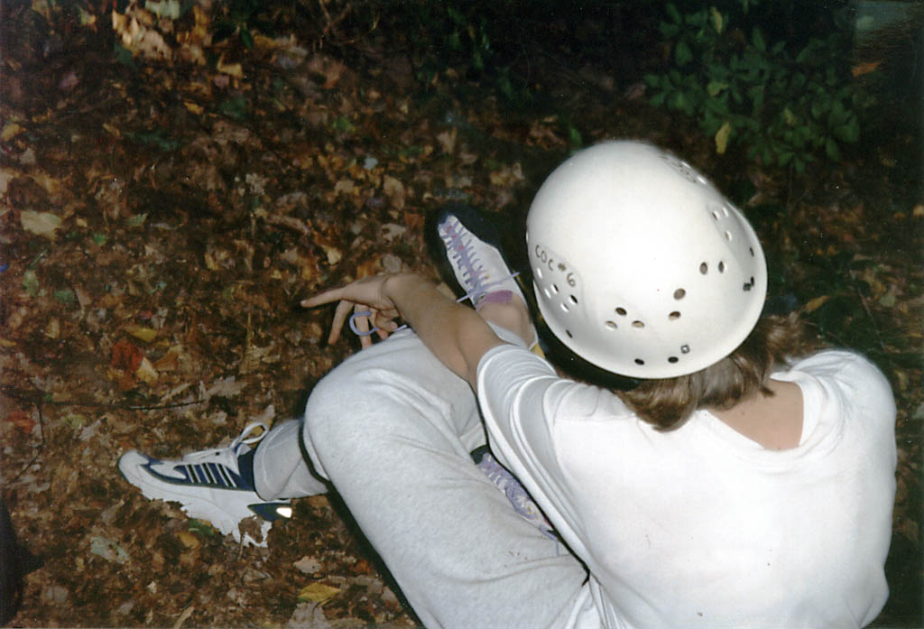 Sarah putting on climbing shoes. (Category:  Rock Climbing)