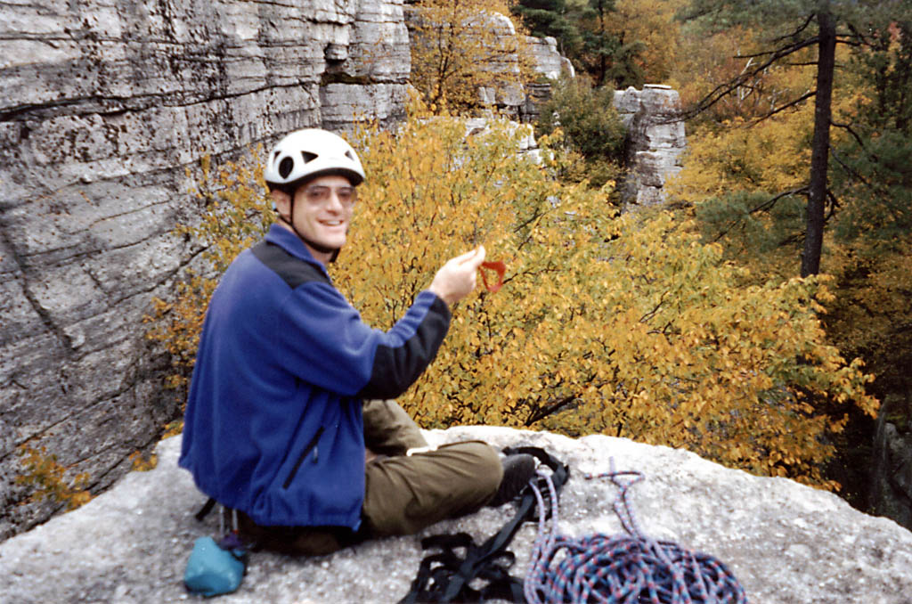 At the top of the cliff. (Category:  Rock Climbing)