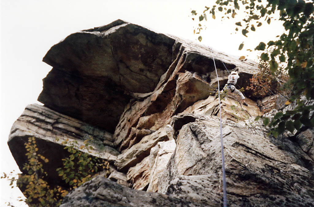 Sarah climbing just right of Sheep's Roof.  The giant roof is visible on the left side of the picture. (Category:  Rock Climbing)