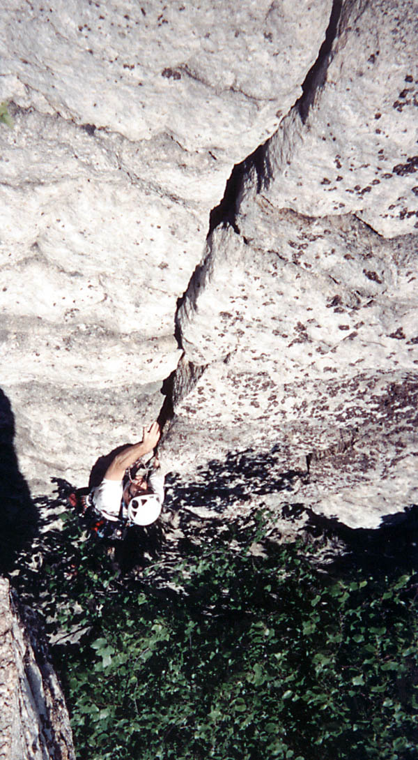Holding a hex in my teeth while working up the 5.5 hand crack near the top of the pitch. (Category:  Rock Climbing)