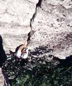 Holding a hex in my teeth while working up the 5.5 hand crack near the top of the pitch. (Category:  Rock Climbing)