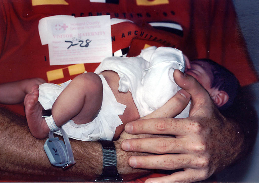 Me holding a one-day-old Nassor. (Category:  Family)