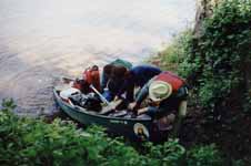 Bailing Mike and Sharon's very wet canoe. (Category:  Paddling)