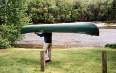 Moving a canoe at the take out. (Category:  Paddling)