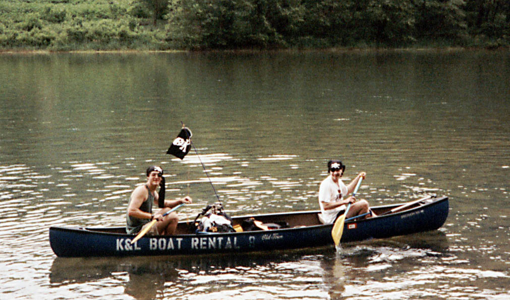 Piracy on the high seas!  Jeff 'Red Beard' and Josh 'White Beard' steal Will and Liz's canoe. (Category:  Paddling)