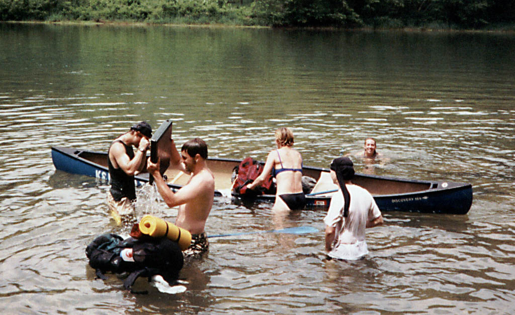 Will drains the water from his big green stove. (Category:  Paddling)