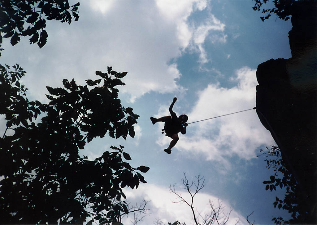 Marci getting some air on an overhanging route. (Category:  Rock Climbing)