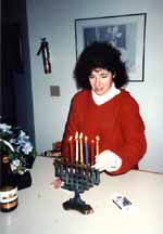 Mom lighting Hanukkah candles. (Category:  Skiing)