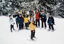 Snowshoeing with the skigroup as they prepare to pelt me with snowballs. (Category:  Skiing)