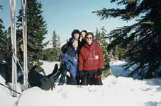 Joanna, Marci, Ann and me posing for the camera. (Category:  Skiing)
