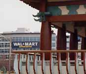 A traditional Korean pavilion with a Wal-Mart Supercenter in the background. (Category:  Travel)