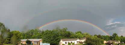 It was actually a double rainbow.  This panorama gives some idea of what it looked like. (Category:  Residence)