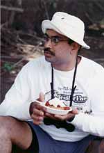 Rajesh enjoying dessert. (Category:  Paddling)