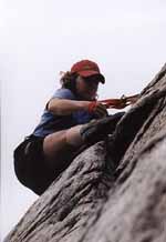 Lindsay setting an anchor. (Category:  Rock Climbing)