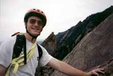 Near the top of the First, with other Flatirons in the background. (Category:  Rock Climbing)