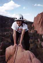 Lauren reaching the summit. (Category:  Rock Climbing)