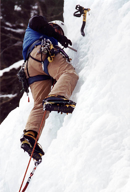 Marcus placing a screw. (Category:  Ice Climbing)