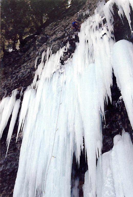 Climber nearing the top of Play It Again, Salmon (WI5+/M6). (Category:  Ice Climbing)