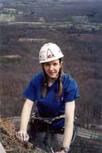 Carla toping out on Sixish.  Her nose had been broken just 24 hours earlier in a trust fall accident while teaching High Adventure. (Category:  Rock Climbing)