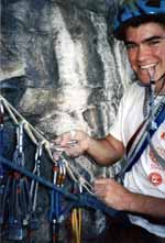 Kyle swapping gear at the belay. (Category:  Rock Climbing)
