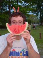 At Brielle's Friday picnic.  Tina providing bunny ears. (Category:  Party)