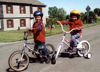 Taking Nassor and Sophia for a bike ride.  Sophia's first bike! (Category:  Family)