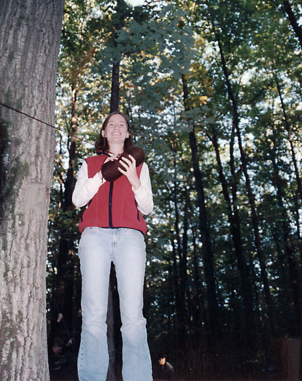 Shoshannah putting up the Erev prior to celebrating shabbat in the woods. (Category:  Camping)