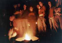 Teva standing around the campfire. (Category:  Camping)