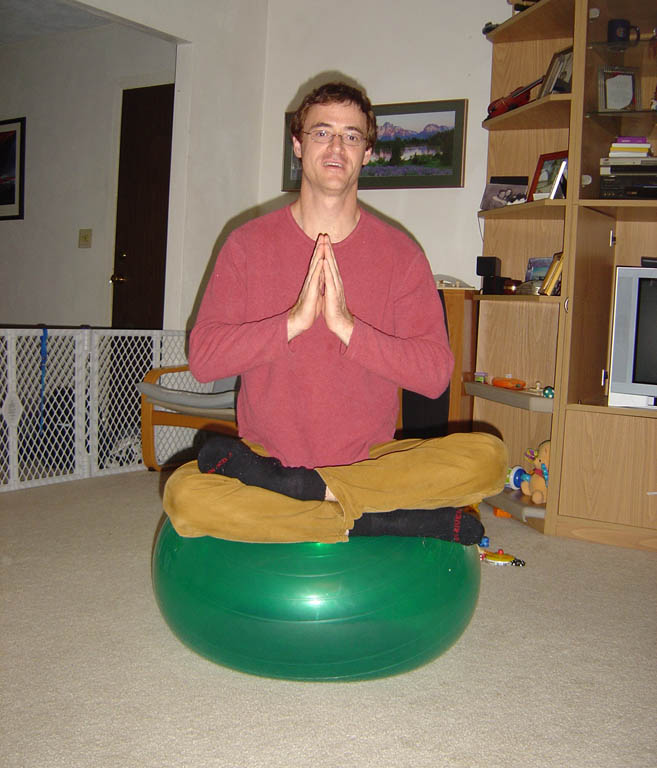 Yoga master balancing on the exercise ball at Jason and Carla's house. (Category:  Party)
