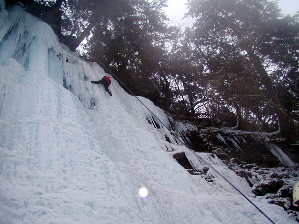 Getting a rest on a high foot near the top of Salmon Runs. (Category:  Ice Climbing)