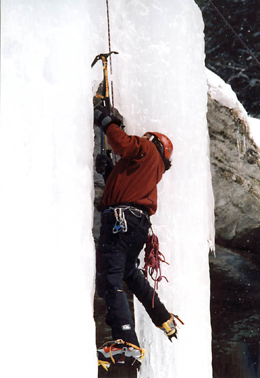 Rich transitioning from one icicle to another. (Category:  Ice Climbing)