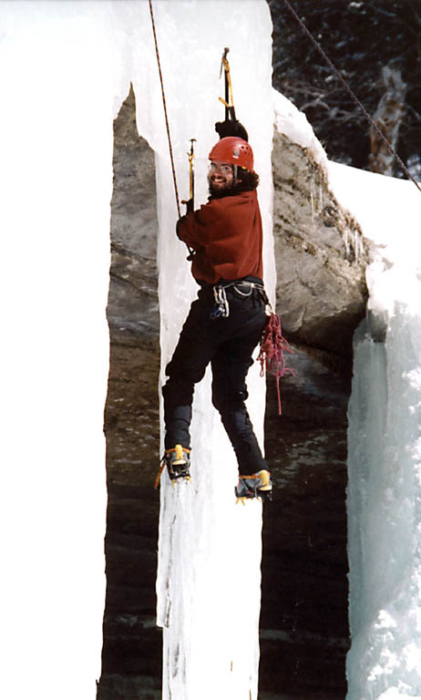 Rich transitioning from one icicle to another. (Category:  Ice Climbing)