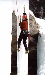 Rich transitioning from one icicle to another. (Category:  Ice Climbing)