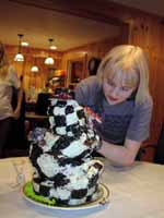 Jill putting the finishing touches on the cake. (Category:  Party)
