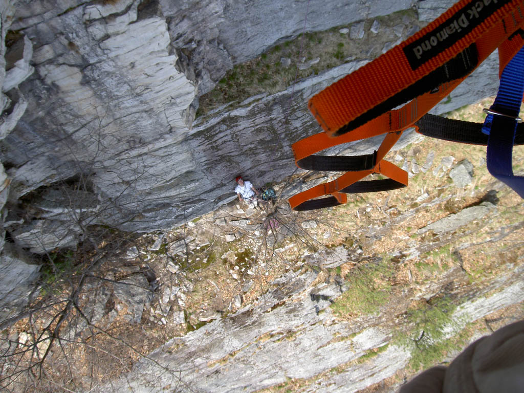 Joe's view past his etriers of me at the belay. (Category:  Rock Climbing)