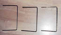 Fig. 5: Three segments of wire hanger which will be assembled to make a pot stand. (Category:  Resources)