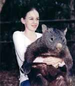 Small girl with a big Wombat. (Category:  Travel)