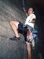 Burk climbing Laurel with one hand. (Category:  Rock Climbing)