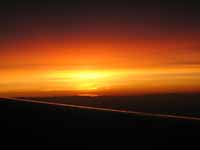 Sunrise viewed from the airplane. (Category:  Travel)