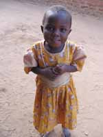 I love how the little kids wear very fancy clothes when they are playing in the street. (Category:  Travel)