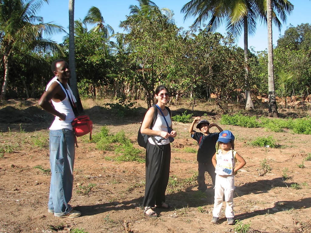 Hussein, Rachel, Nassor and Sophia on their plot of land. (Category:  Travel)