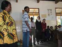 Hussein talking to a class full of kids. (Category:  Travel)