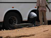 Replacing the leaf spring during the bus ride from hell. (Category:  Travel)