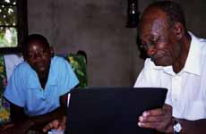 Habiba and Mzee learning computer basics. (Category:  Travel)