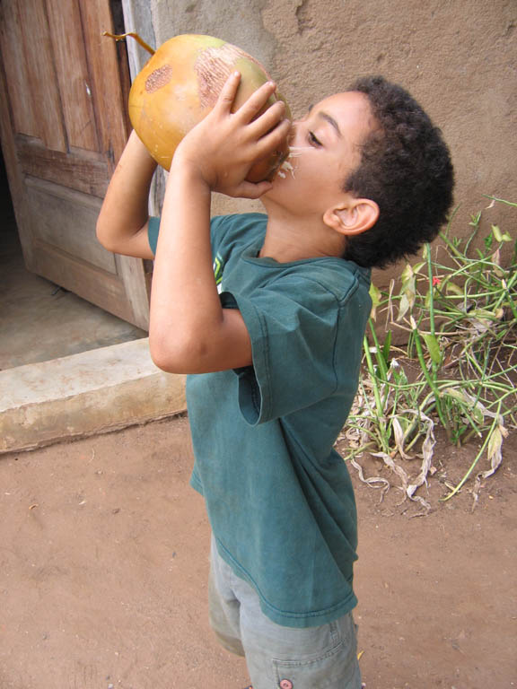 Nassor drinking Madafu. (Category:  Travel)