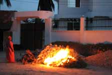 Burning trash at night. (Category:  Travel)