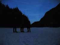 Me, Jesse and Rayko lit by the moon while walking back to camp across frozen Chapel Pond. (Category:  Ice Climbing)