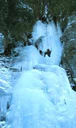 Rayko stemming wide at the top of Ice Slot. (Category:  Ice Climbing)