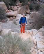 Ryan boulder hopping down the north fork of Oak Creek in the final part of our descent from Black Orpheus. (Category:  Rock Climbing)