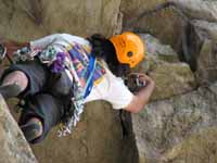 Vijay leaning out to place gear at the start of the Modern Times roof. (Category:  Rock Climbing)